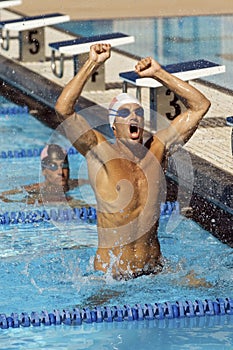 Swimmer Celebrating Victory In Pool