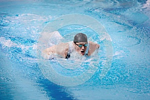 Swimmer in competition swimwear taking breath