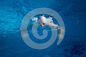 Swimmer excercise on indoor swimming poo