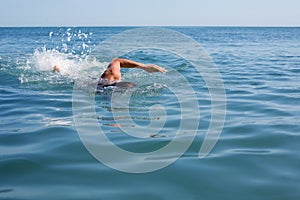 Swimmer floating crawl photo