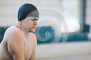 Swimmer jumping off the starting block