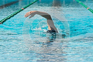 swimmer in lane pool, man in water