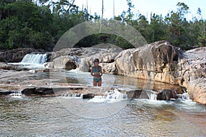 A Swimmer in the Macal River Below Macal River Falls