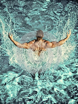 Swimmer man swim in blue water pool