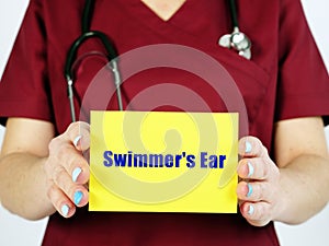 Swimmer`s Ear Otitis Externa phrase on the sheet photo
