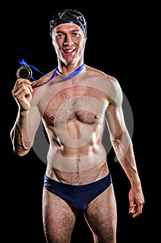 Swimmer showing his gold medal