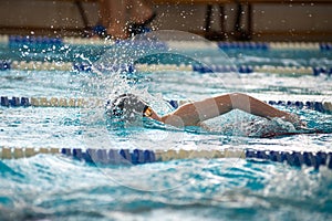 Swimmer swims freestyle swimming style in the pool