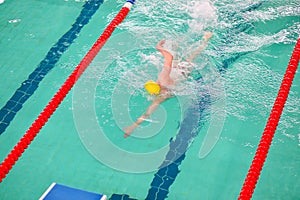The swimmer swims in the pool. Participation in the competition. Sport, health and active life