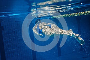 Swimmer woman underwater during her workout in the pool