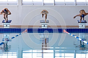 Swimmers plunging in the pool