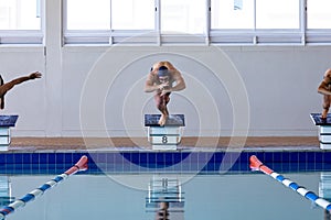 Swimmers plunging in the pool