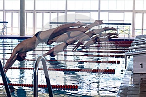 Swimmers plunging in the pool