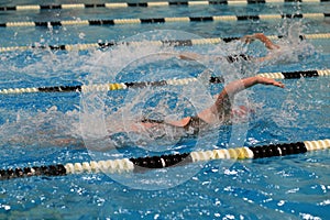 Swimmers racing in the pool