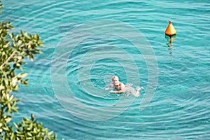 Swimming and bathing people in the sea, dam and lakes. Summer.