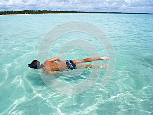 Swimming in crystalline clear sea in Brazil