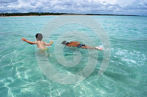 Swimming in crystalline clear waters sea in Brazil