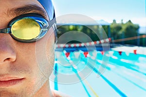 Swimming goggles, sports and portrait of man for pool exercise, outdoor workout or training practice. Commitment