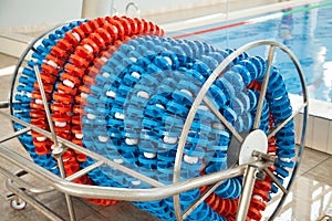 Swimming lanes markers in reel storage, near the pool. Pool lane lines for athletics, swimming