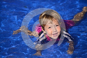 Swimming lessons: Cute baby girl n the pool