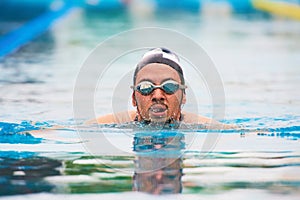 Swimming man in pool