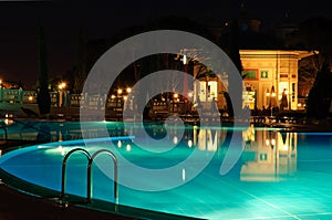 Swimming pool area in night illumination