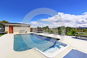 Swimming pool at the back yard of luxury house