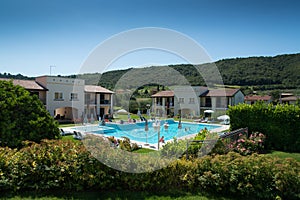 Swimming pool with bathers travelers in Italy photo