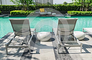 Swimming pool with beach chairs