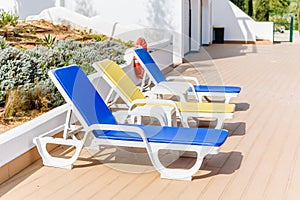 Swimming pool with beach chairs sunbeds