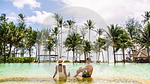 swimming pool on the beach of Thailand, luxury vacation in Thailand ,couple on holiday in Thailand