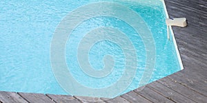 Swimming pool with blue water detail and movement detection alarm aside