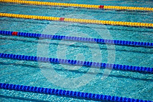 Swimming pool with blue and yellow ropes ready for a swimming competition