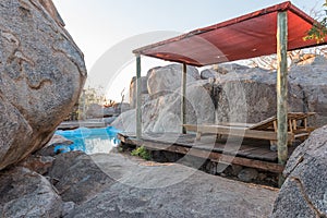 Swimming pool between boulders on a hill at Hoada Camp