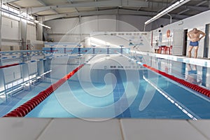 Swimming pool with clean water in the sports complex for athletes young and old