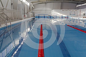 Swimming pool with clean water in the sports complex for athletes young and old