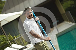 Swimming pool cleaner, professional cleaning service at work.