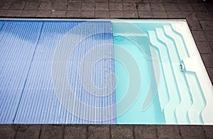 Swimming pool cover detail for protection and heat the water, pool roller-shutter covers