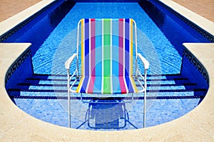 Swimming pool and deckchair