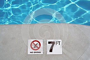 Swimming pool depth marker