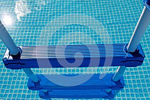 Swimming pool detail with ladder