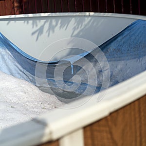 Swimming pool foil damaged with snow