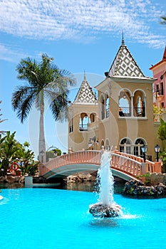 Swimming pool with fountain at luxury hotel