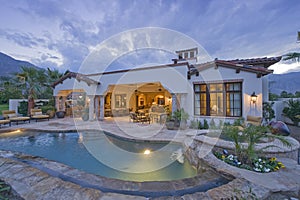 Swimming pool in front of luxury mansion