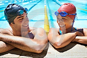 Swimming pool, happy and friends relax after sports exercise, workout routine or training in water. Swimmer, humour and