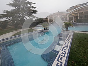 Swimming pool with hot mineral water in winter. Thermal water for the treatment of diseases of the musculoskeletal system.