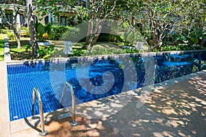 Swimming pool in hotel at tropical resort