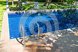 Swimming pool in hotel at tropical resort