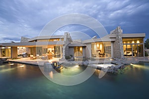 Swimming Pool And Illuminated Modern House