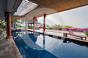 Swimming pool inside Thai style house