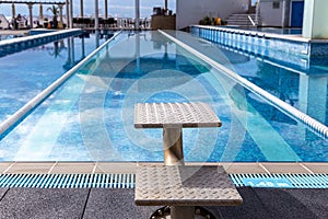 Swimming pool with jumpstand and swimming lanes